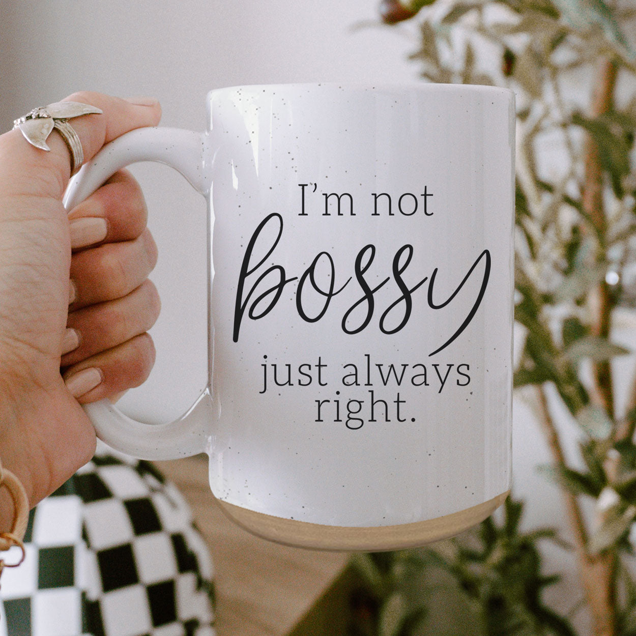 A stylish off-white ceramic coffee mug with dark speckles, featuring the bold text 'I'm Not Bossy, Just Always Right' on both sides.