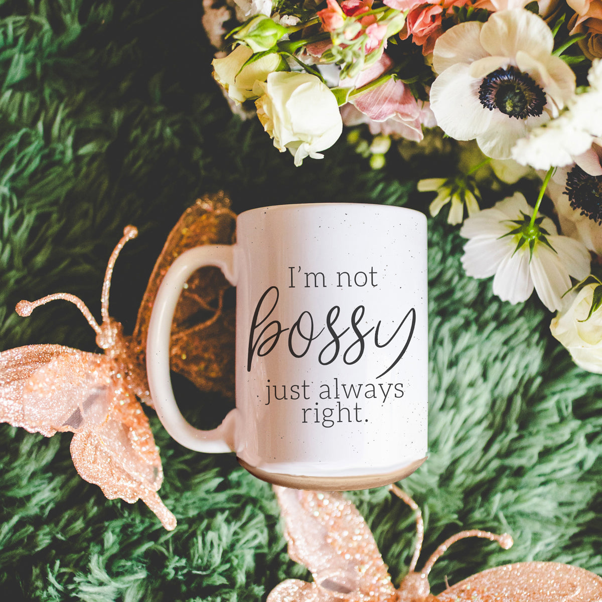 A stylish off-white ceramic coffee mug with dark speckles, featuring the bold text 'I'm Not Bossy, Just Always Right' on both sides.