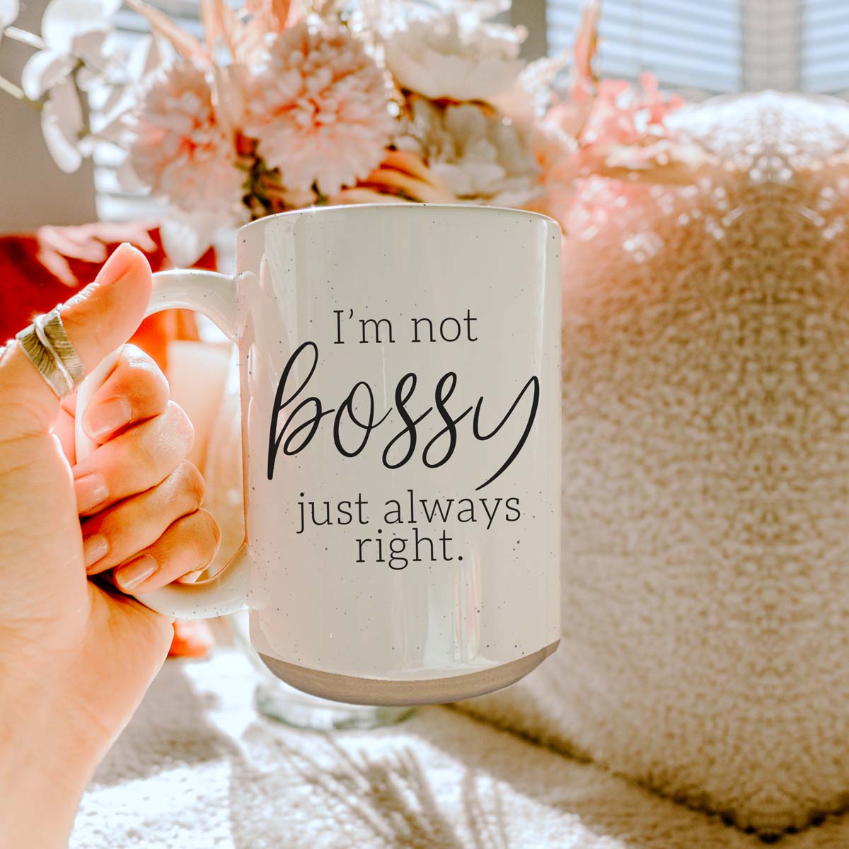 A stylish off-white ceramic coffee mug with dark speckles, featuring the bold text 'I'm Not Bossy, Just Always Right' on both sides.