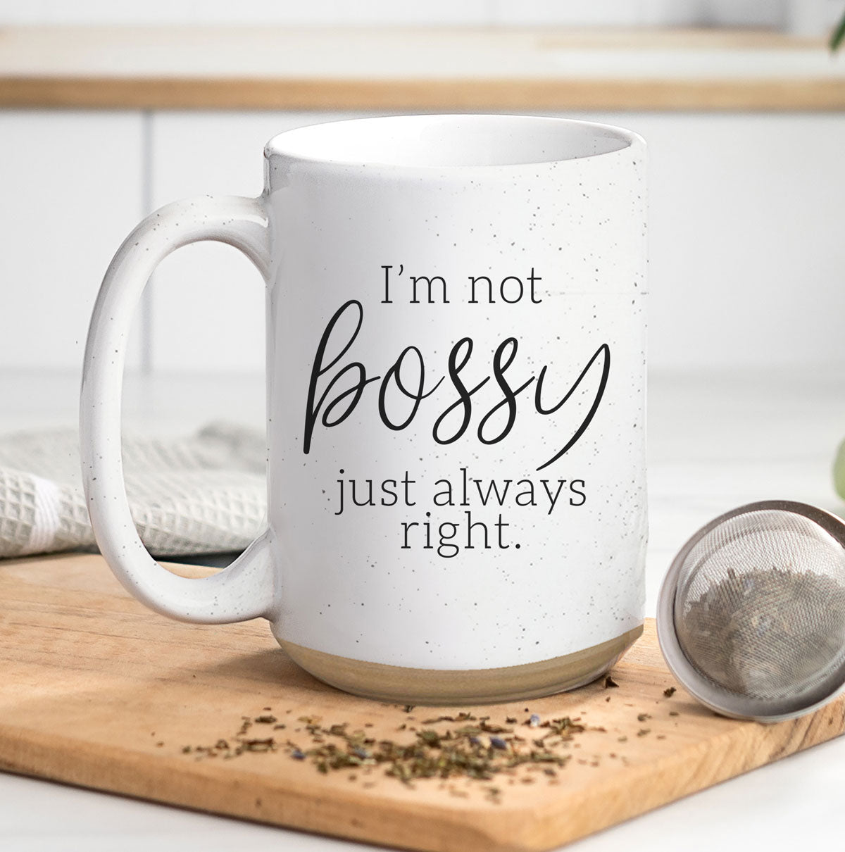 A stylish off-white ceramic coffee mug with dark speckles, featuring the bold text 'I'm Not Bossy, Just Always Right' on both sides.