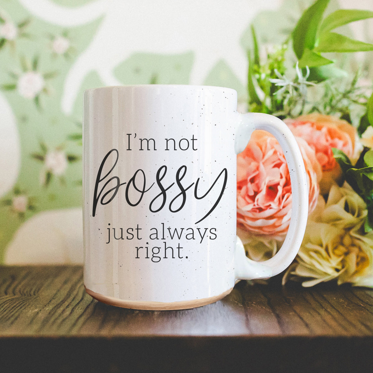 A stylish off-white ceramic coffee mug with dark speckles, featuring the bold text 'I'm Not Bossy, Just Always Right' on both sides.