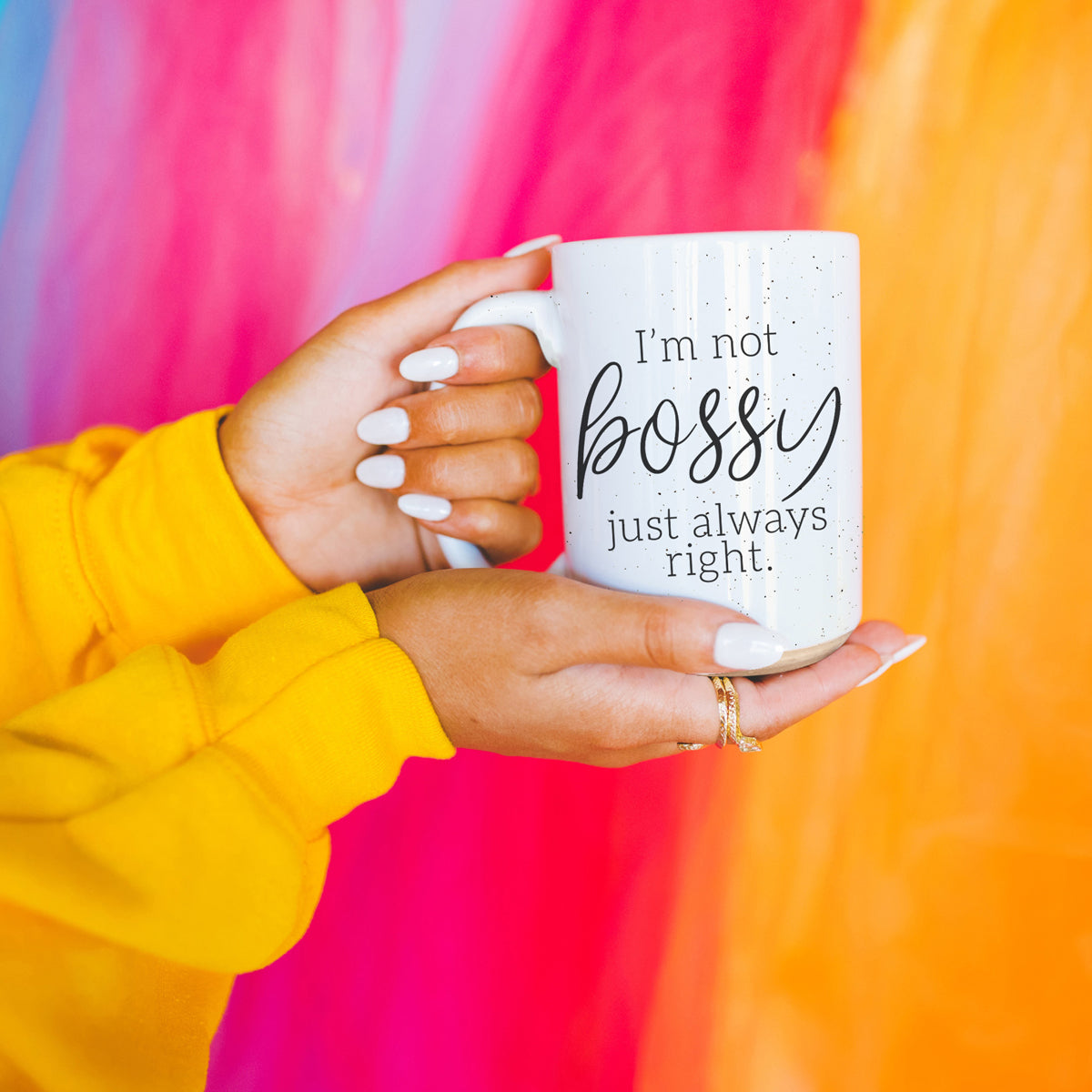 A stylish off-white ceramic coffee mug with dark speckles, featuring the bold text 'I'm Not Bossy, Just Always Right' on both sides.