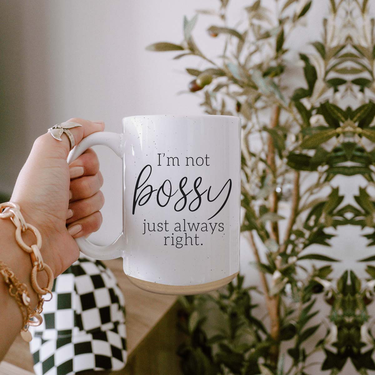 A stylish off-white ceramic coffee mug with dark speckles, featuring the bold text 'I'm Not Bossy, Just Always Right' on both sides.