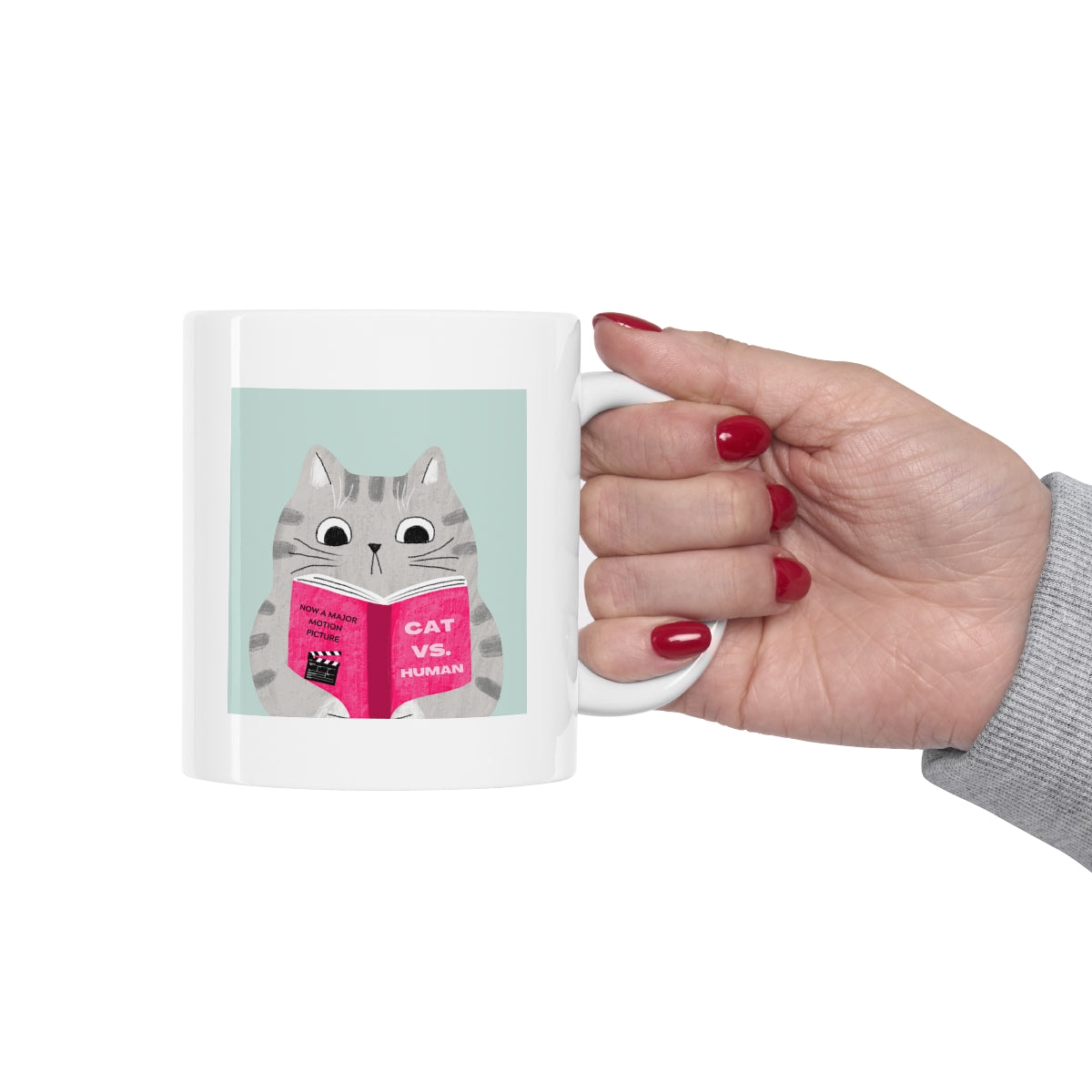 A humorous Cat Vs. Human Funny Mug made of white ceramic, featuring a playful design, perfect for coffee and tea lovers.