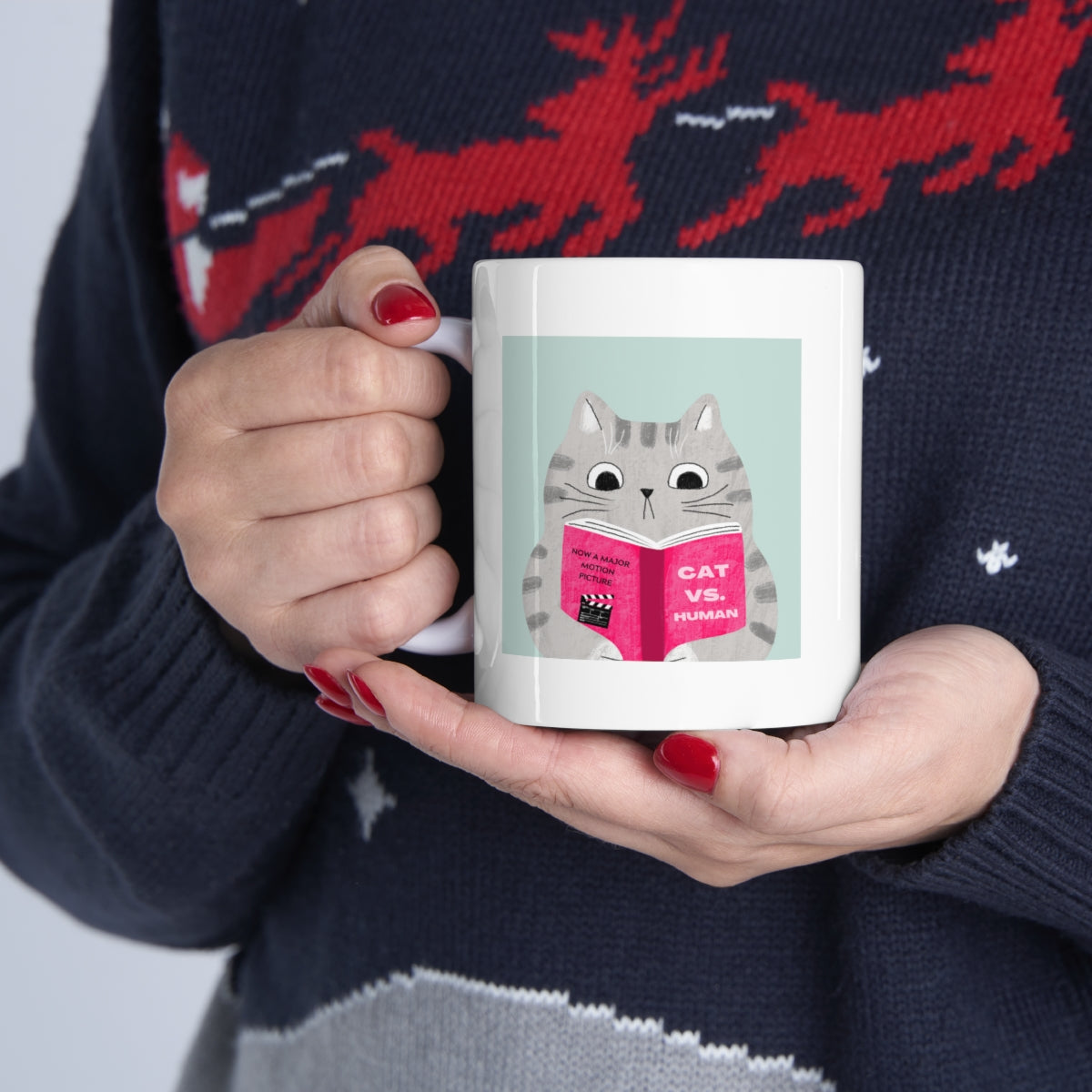 A humorous Cat Vs. Human Funny Mug made of white ceramic, featuring a playful design, perfect for coffee and tea lovers.