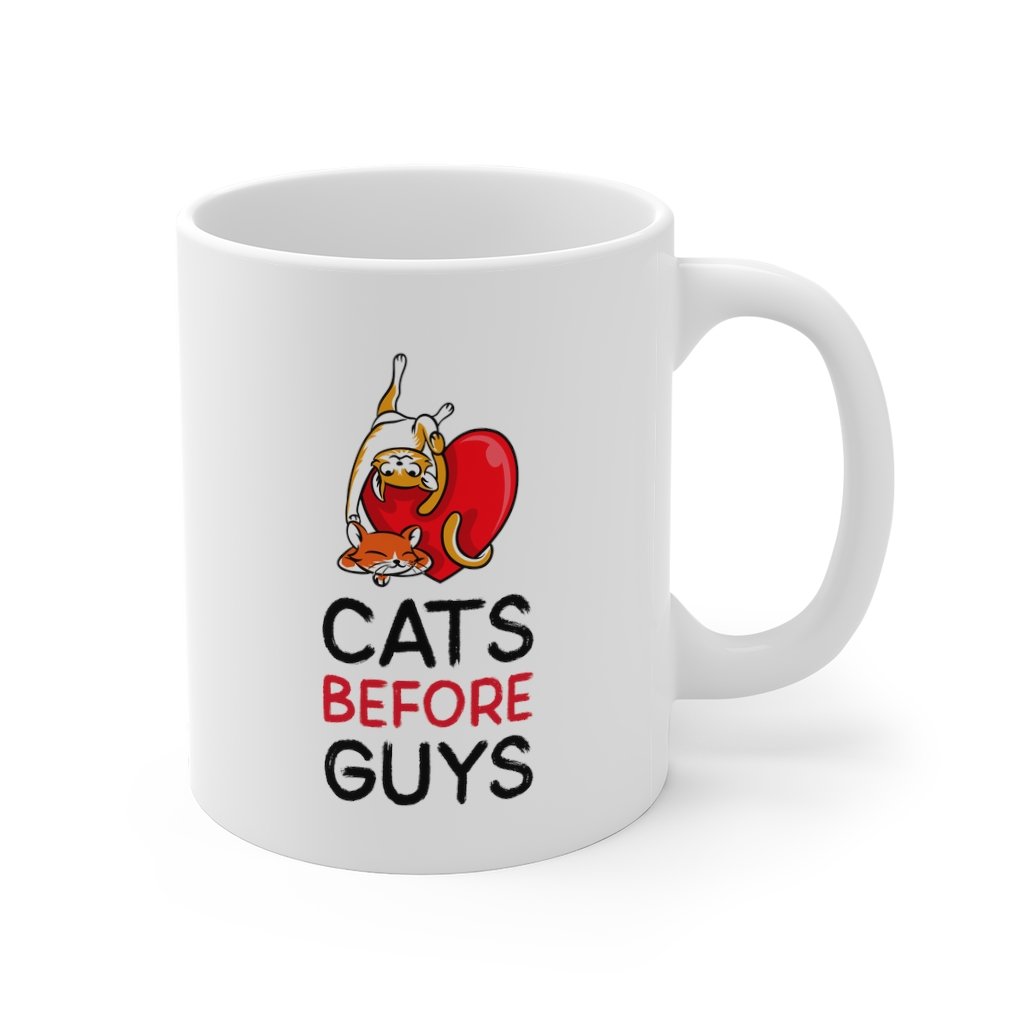 A white ceramic mug with the phrase 'Cats Before Guys' printed on it, featuring a classic design and C-handle.