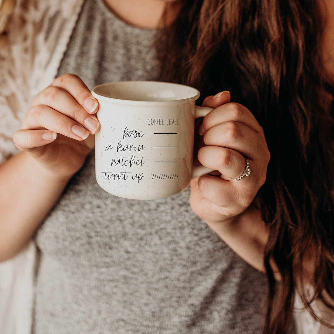 A stylish Don't be a Karen Coffee Mug with a white sesame glaze, featuring black lettering and speckles, designed for daily use.