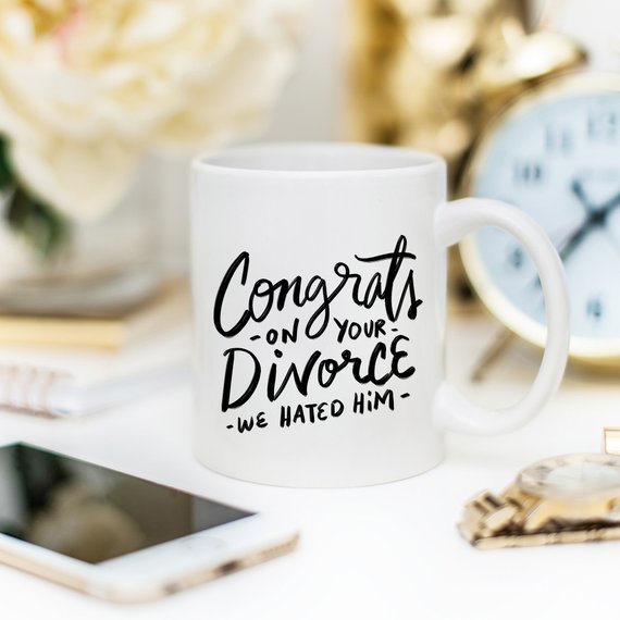 Congrats Divorce Mug featuring a vibrant design on a white ceramic mug with a black handle and rim, perfect for celebrating new beginnings.