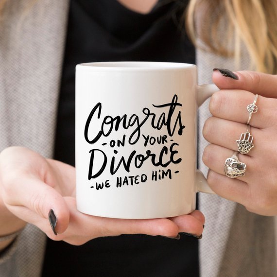 Congrats Divorce Mug featuring a vibrant design on a white ceramic mug with a black handle and rim, perfect for celebrating new beginnings.