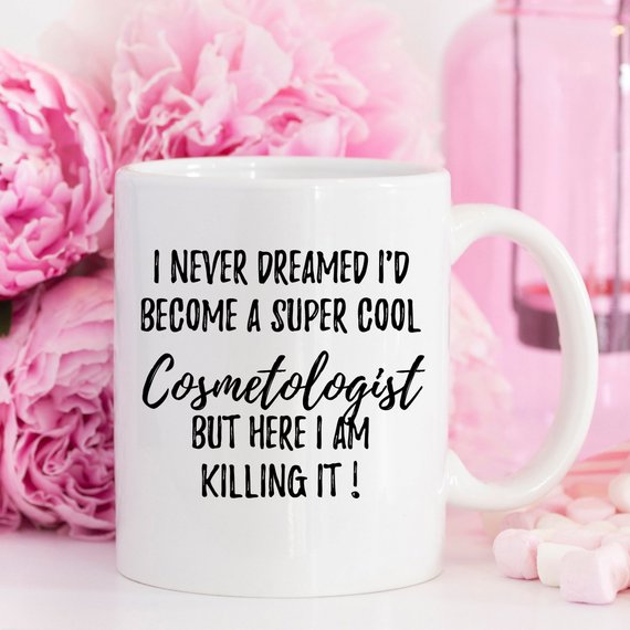 A stylish white Cosmetologist Mug featuring a vibrant design on both sides, perfect for coffee or tea lovers in the beauty industry.