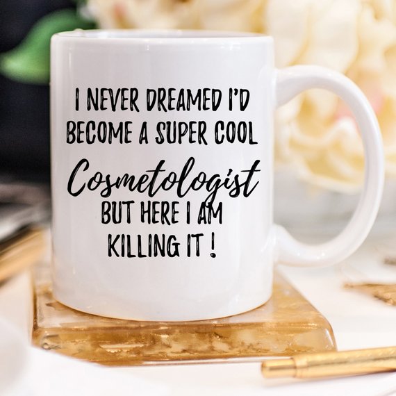 A stylish white Cosmetologist Mug featuring a vibrant design on both sides, perfect for coffee or tea lovers in the beauty industry.