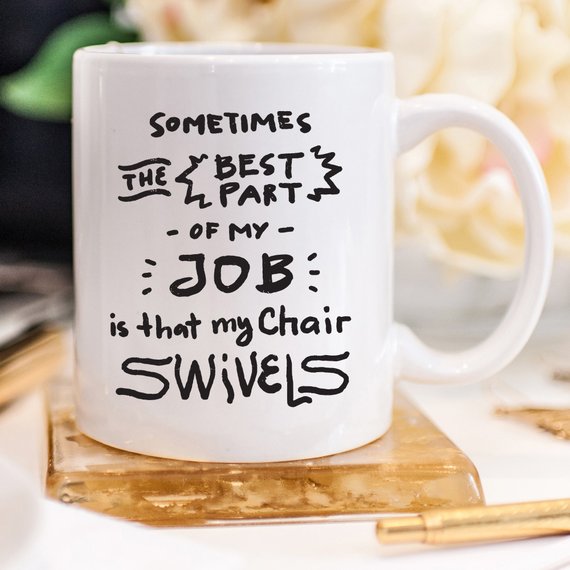 Funny coffee mug with humorous text about job satisfaction, designed for coworkers.