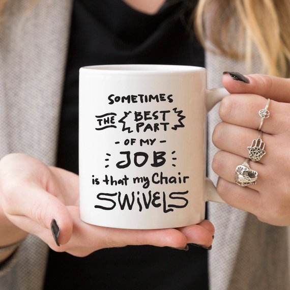 Funny coffee mug with humorous text about job satisfaction, designed for coworkers.