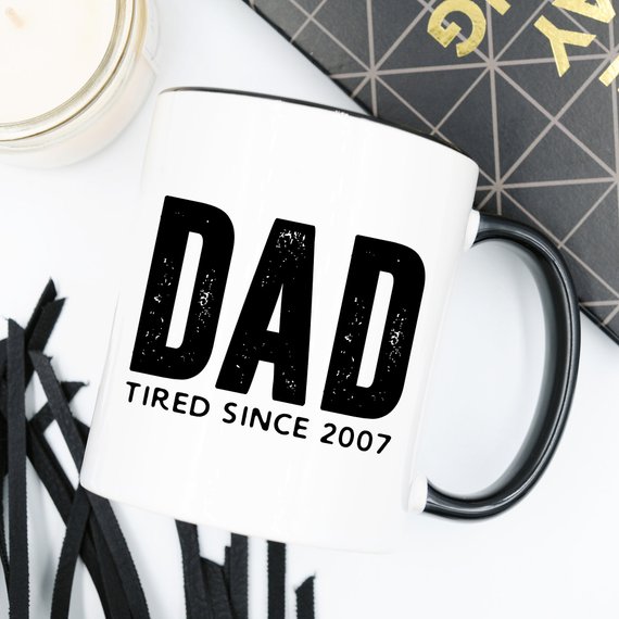 A humorous coffee mug with the text 'Dad Tired Since 2007', crafted from high-quality ceramic, perfect for Father's Day gifts.