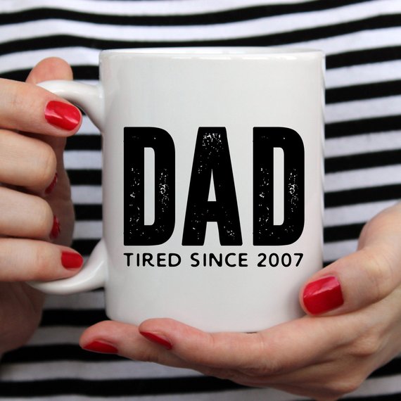 A humorous coffee mug with the text 'Dad Tired Since 2007', crafted from high-quality ceramic, perfect for Father's Day gifts.