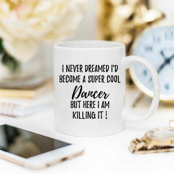 A stylish white ceramic mug featuring a vibrant dancer design on both sides, perfect for dance enthusiasts.