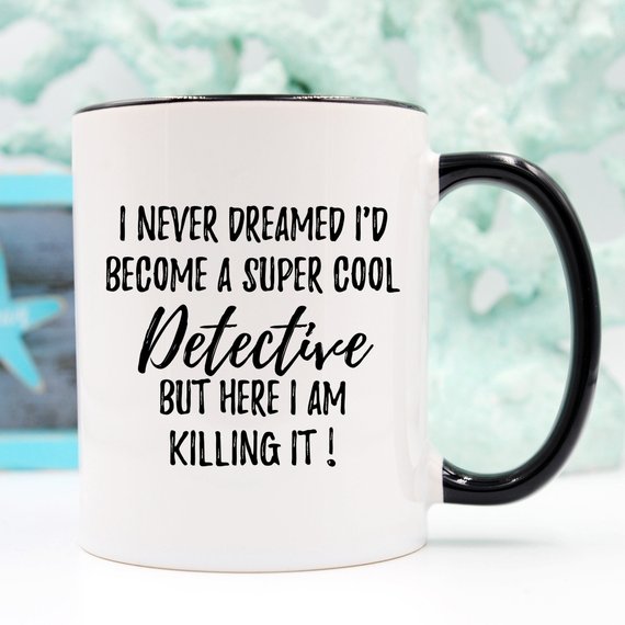 A stylish white ceramic mug featuring a detective-themed design, printed on both sides, perfect for coffee lovers and detectives.