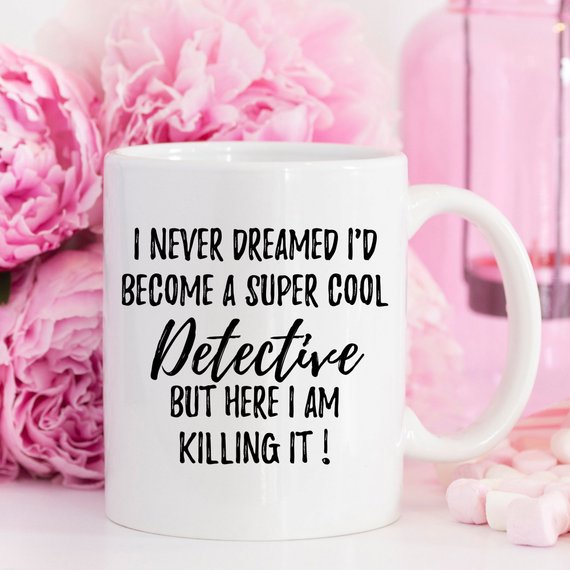 A stylish white ceramic mug featuring a detective-themed design, printed on both sides, perfect for coffee lovers and detectives.