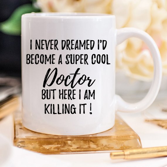 A white ceramic Doctor Mug featuring a vibrant design printed on both sides, perfect for gifting to medical professionals.