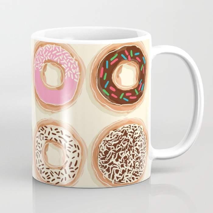 A vibrant 15-ounce ceramic mug featuring a whimsical doughnut design, perfect for coffee or tea lovers, with a large handle for easy gripping.