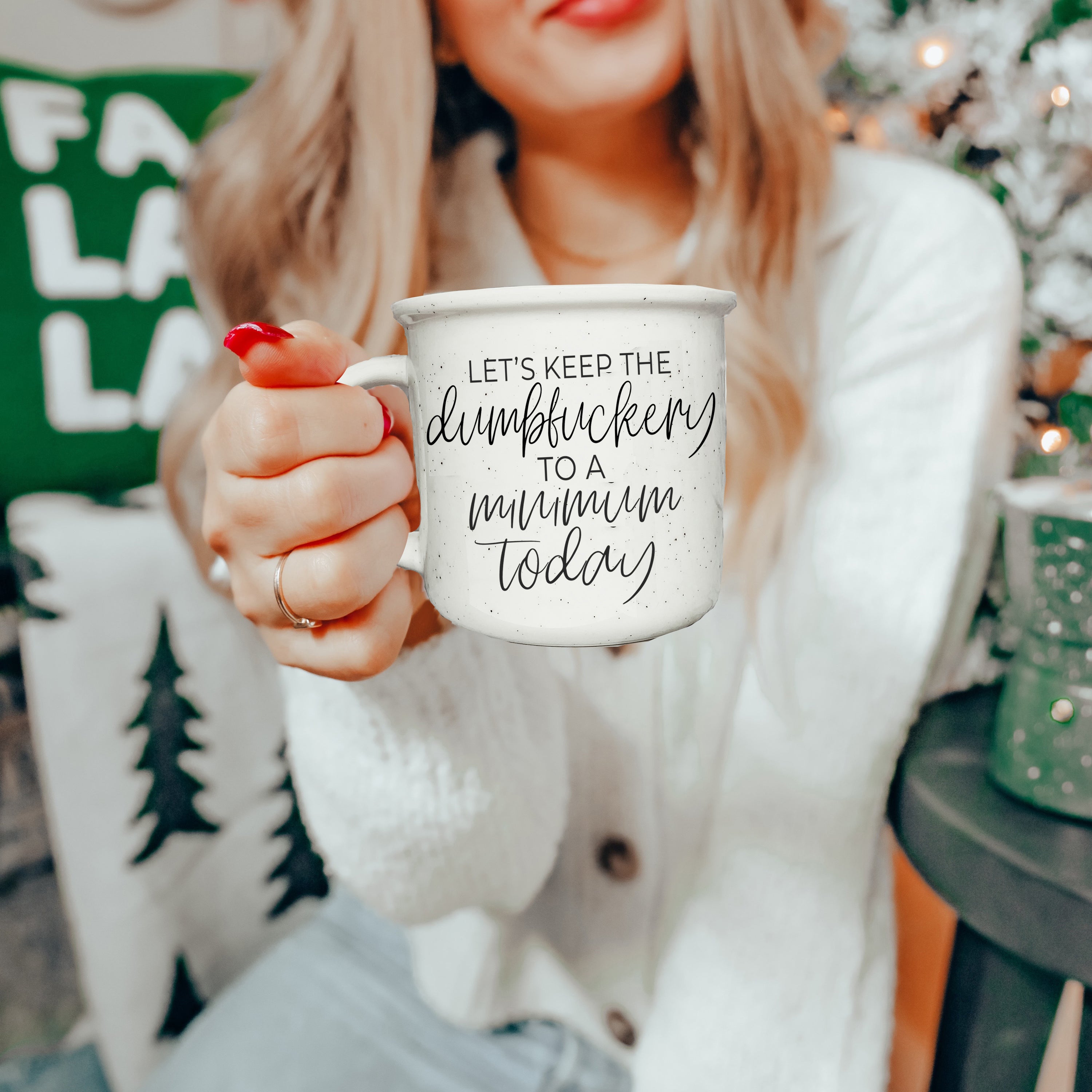 Dumbf**kery Mug featuring a humorous phrase in black lettering on a light ivory ceramic background with speckles.