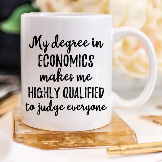 A white ceramic mug featuring vibrant economics-themed designs on both sides, perfect for coffee or tea.