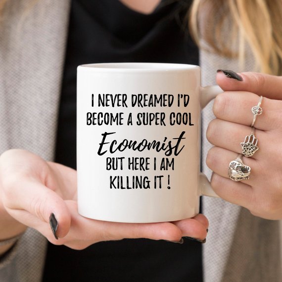 A white ceramic mug featuring a vibrant economist-themed design printed on both sides, perfect for coffee or tea.