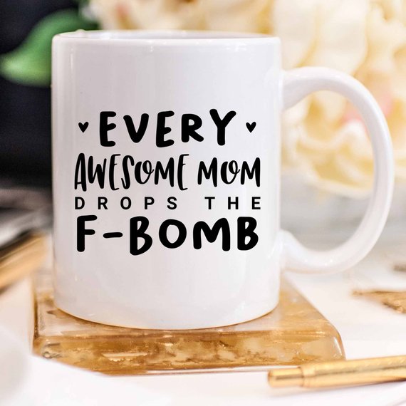 Every Awesome Mom Drops the F Bomb Mug, white ceramic mug with humorous text printed on both sides.