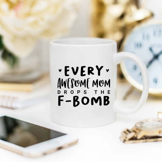 Every Awesome Mom Drops the F Bomb Mug, white ceramic mug with humorous text printed on both sides.