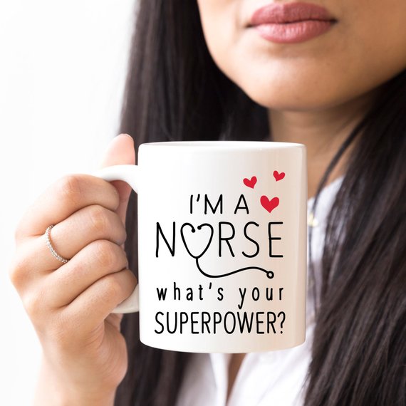 Funny Nurse Mug featuring the text 'I'm A Nurse, What's Your Superpower?' with a vibrant design, perfect for coffee lovers.