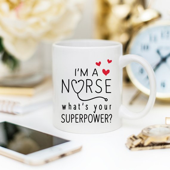 Funny Nurse Mug featuring the text 'I'm A Nurse, What's Your Superpower?' with a vibrant design, perfect for coffee lovers.