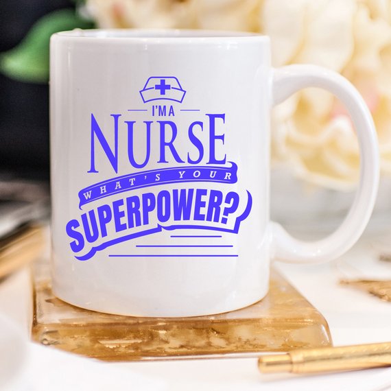 Funny Nurse Mug featuring the text 'I'm A Nurse, What's Your Superpower?' in bold letters, perfect for coffee lovers.