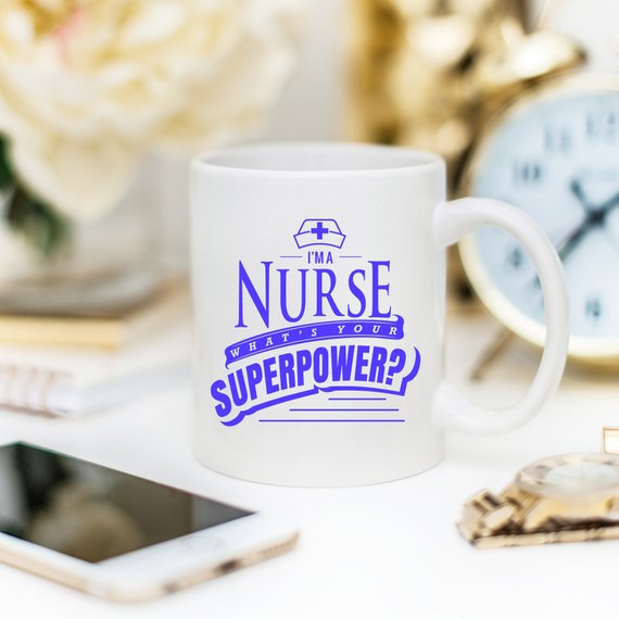 Funny Nurse Mug featuring the text 'I'm A Nurse, What's Your Superpower?' in bold letters, perfect for coffee lovers.