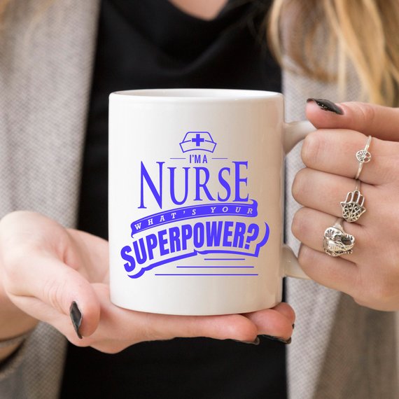 Funny Nurse Mug featuring the text 'I'm A Nurse, What's Your Superpower?' in bold letters, perfect for coffee lovers.