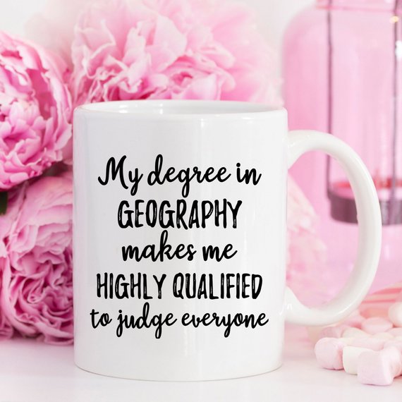 A white ceramic Geographer Mug featuring a vibrant design on both sides, perfect for geography enthusiasts.