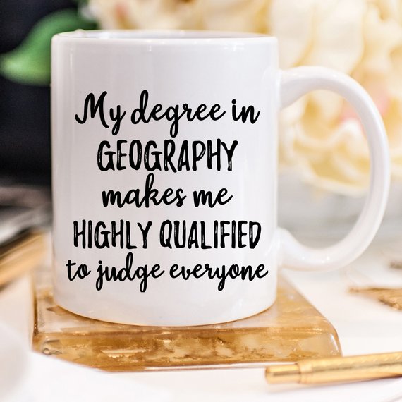 A white ceramic Geographer Mug featuring a vibrant design on both sides, perfect for geography enthusiasts.