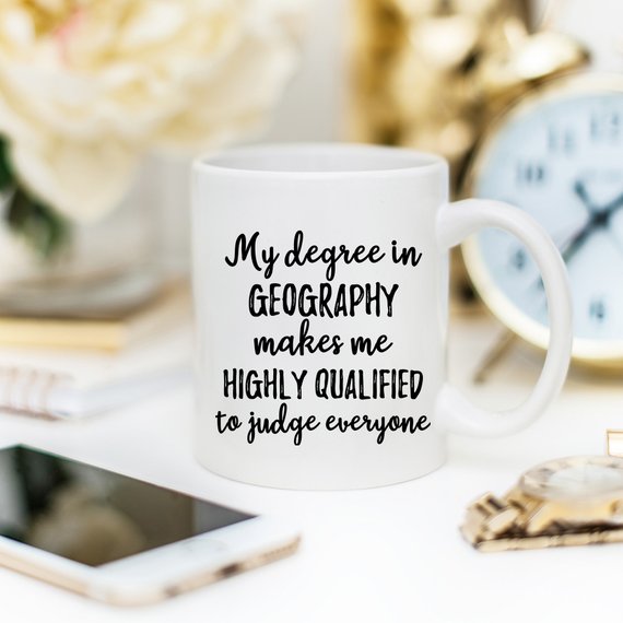 A white ceramic Geographer Mug featuring a vibrant design on both sides, perfect for geography enthusiasts.