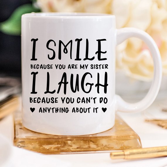 Funny coffee mug with a humorous quote for sisters, showcasing a playful design and high-quality ceramic material.