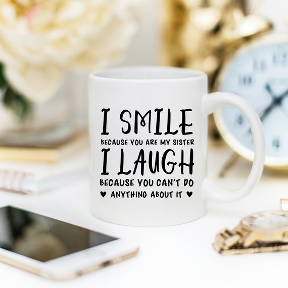 Funny coffee mug with a humorous quote for sisters, showcasing a playful design and high-quality ceramic material.