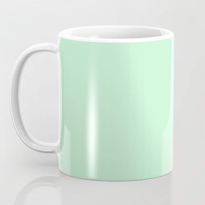 A colorful ceramic coffee mug featuring a whimsical sprinkle design, perfect for enjoying hot or cold beverages.