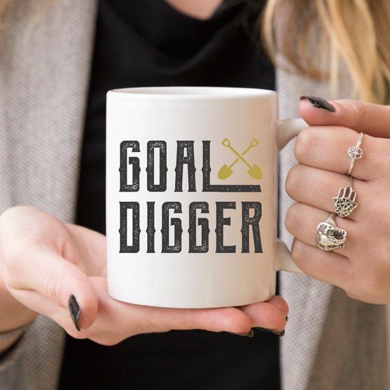 A stylish Goal Digger Mug featuring a humorous design, perfect for entrepreneurs and girl bosses, made from high-quality ceramic.