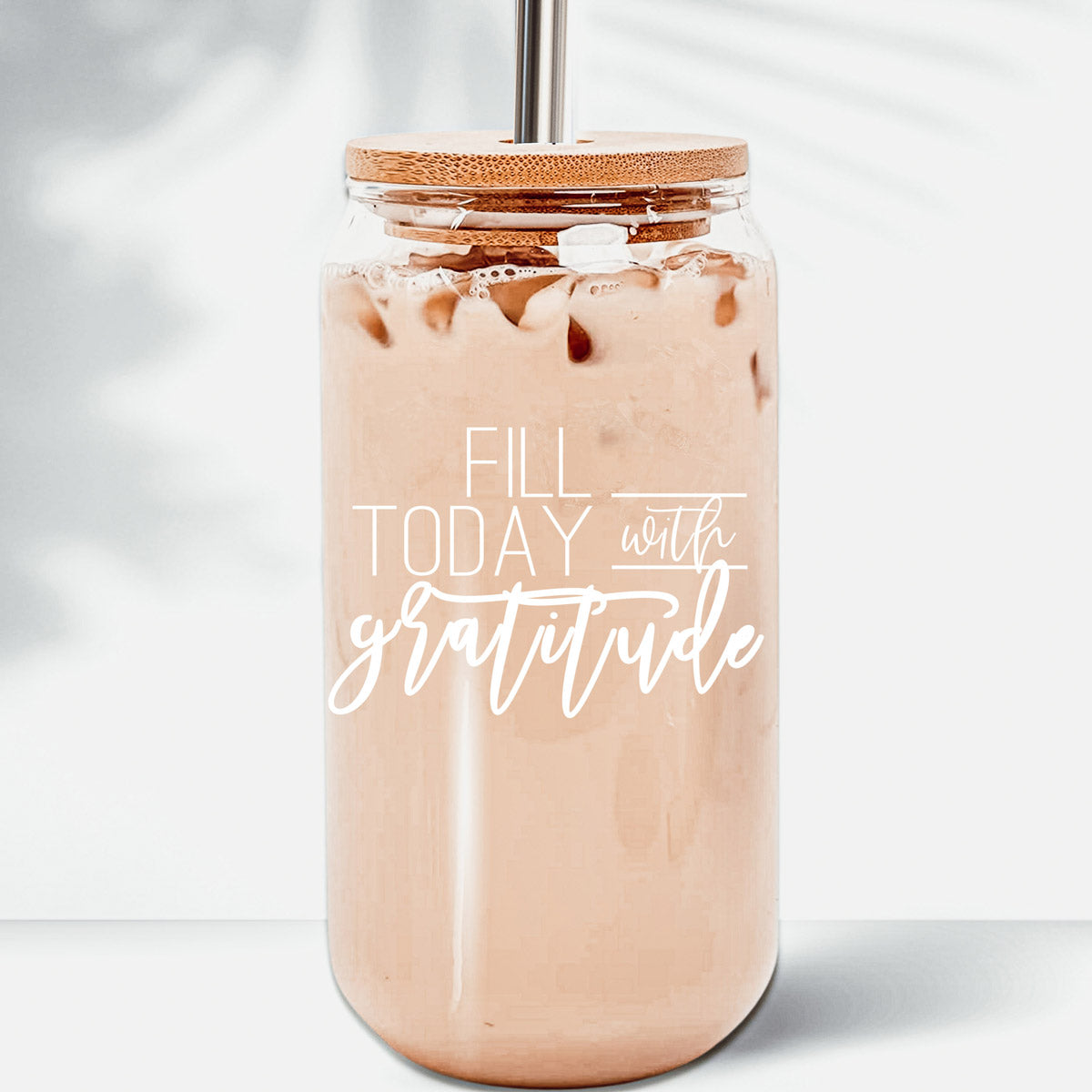 Gratitude Set featuring high borosilicate glass cups with bamboo lids and stainless steel straws, perfect for various beverages.