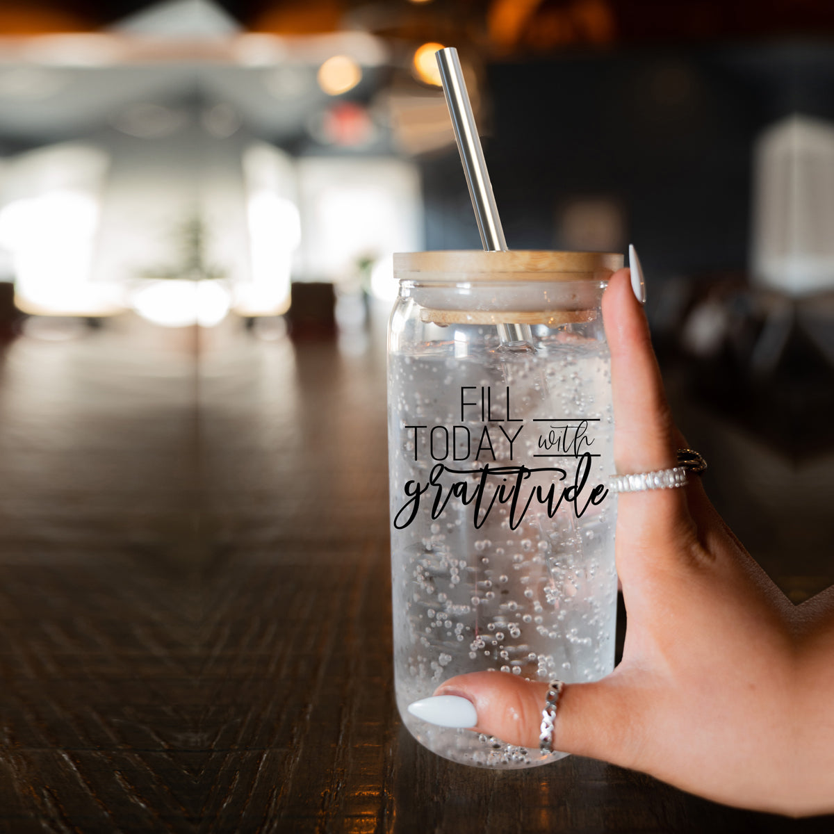 Gratitude Set featuring high borosilicate glass cups with bamboo lids and stainless steel straws, perfect for various beverages.