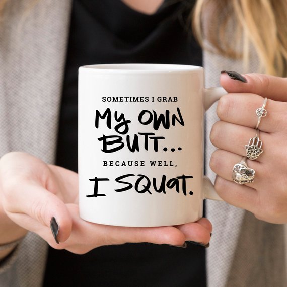 A humorous Gym Teacher Coffee Mug with the phrase 'Sometimes I Grab My Own Butt' printed on it, showcasing a fun design perfect for coffee lovers.