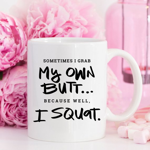 A humorous Gym Teacher Coffee Mug with the phrase 'Sometimes I Grab My Own Butt' printed on it, showcasing a fun design perfect for coffee lovers.