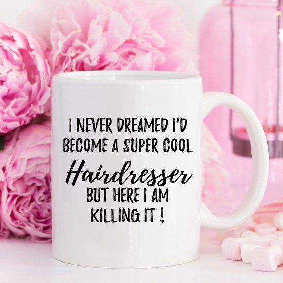 A stylish white ceramic Hairdresser Mug featuring vibrant designs on both sides, perfect for hairstylists.