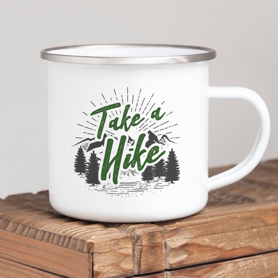 A white enamel mug with a stainless steel rim, featuring a vibrant design on both sides, perfect for hikers and outdoor enthusiasts.