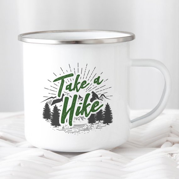 A white enamel mug with a stainless steel rim, featuring a vibrant design on both sides, perfect for hikers and outdoor enthusiasts.