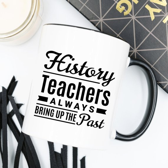 A humorous coffee mug featuring the phrase 'History Teachers Always Bring Up The Past', crafted from high-quality ceramic, ideal for teachers and coffee lovers.