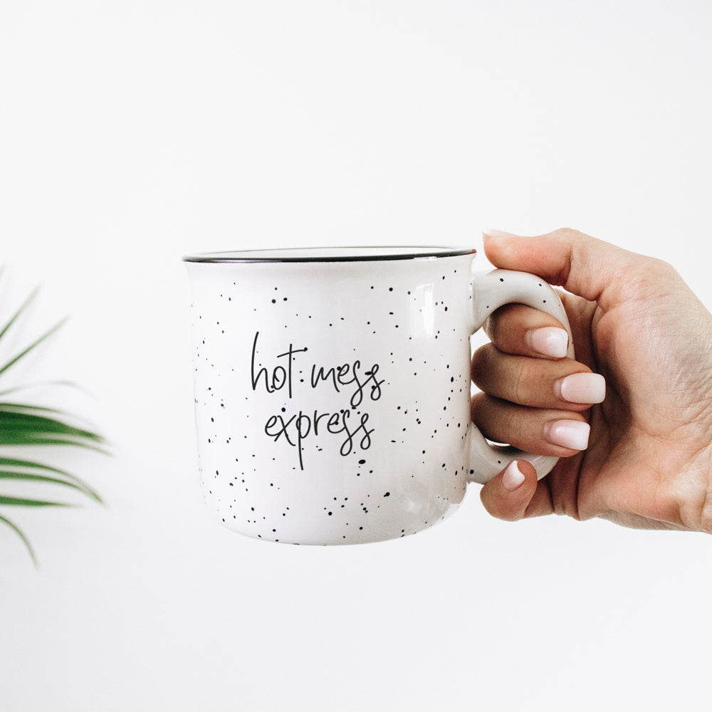 Hot Mess Express oversized campfire mug with black rim, featuring double-sided design and white sesame glaze.